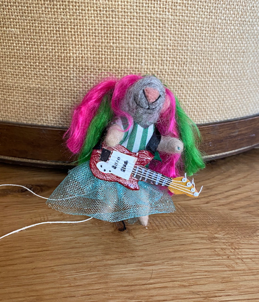Hipster Henrietta Ornament front view with pink and green hair, red guitar, blue toto 