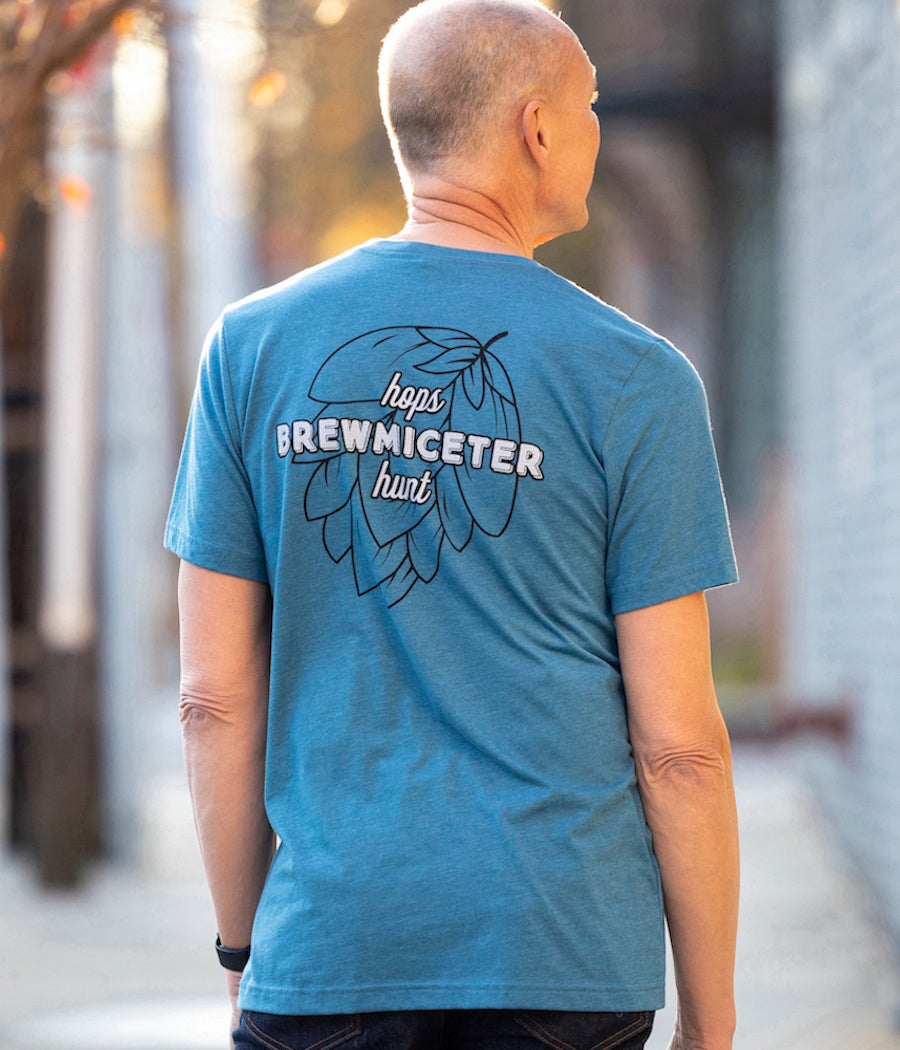 Statement Brewmiceter Hops Hunt deep teal men's design which has our Hops Hunt statement logo on the back in black and white and our hipster mouse done in black to match the back design on the front left chest. 