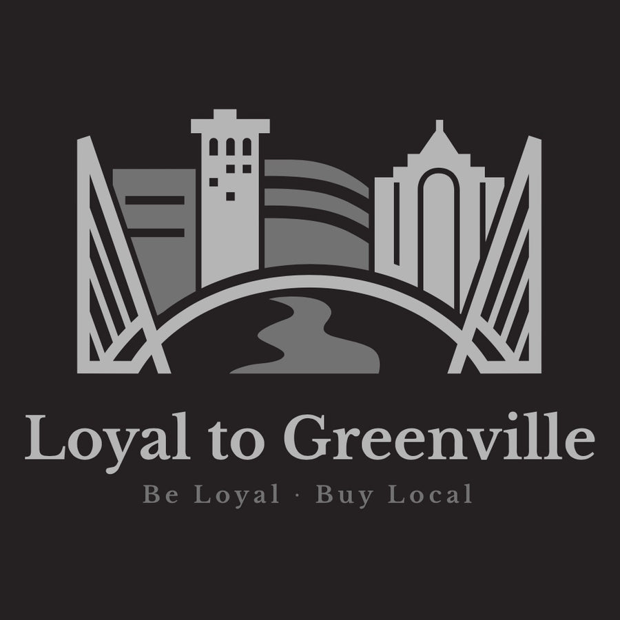 Close up of men's black tee with Loyal to Greenville's statement logo in 2 shades of grey, which has the bridges represented, several outlines of actual buildings here in Greenville, SC along with an icon for the Reedy Falls River.  